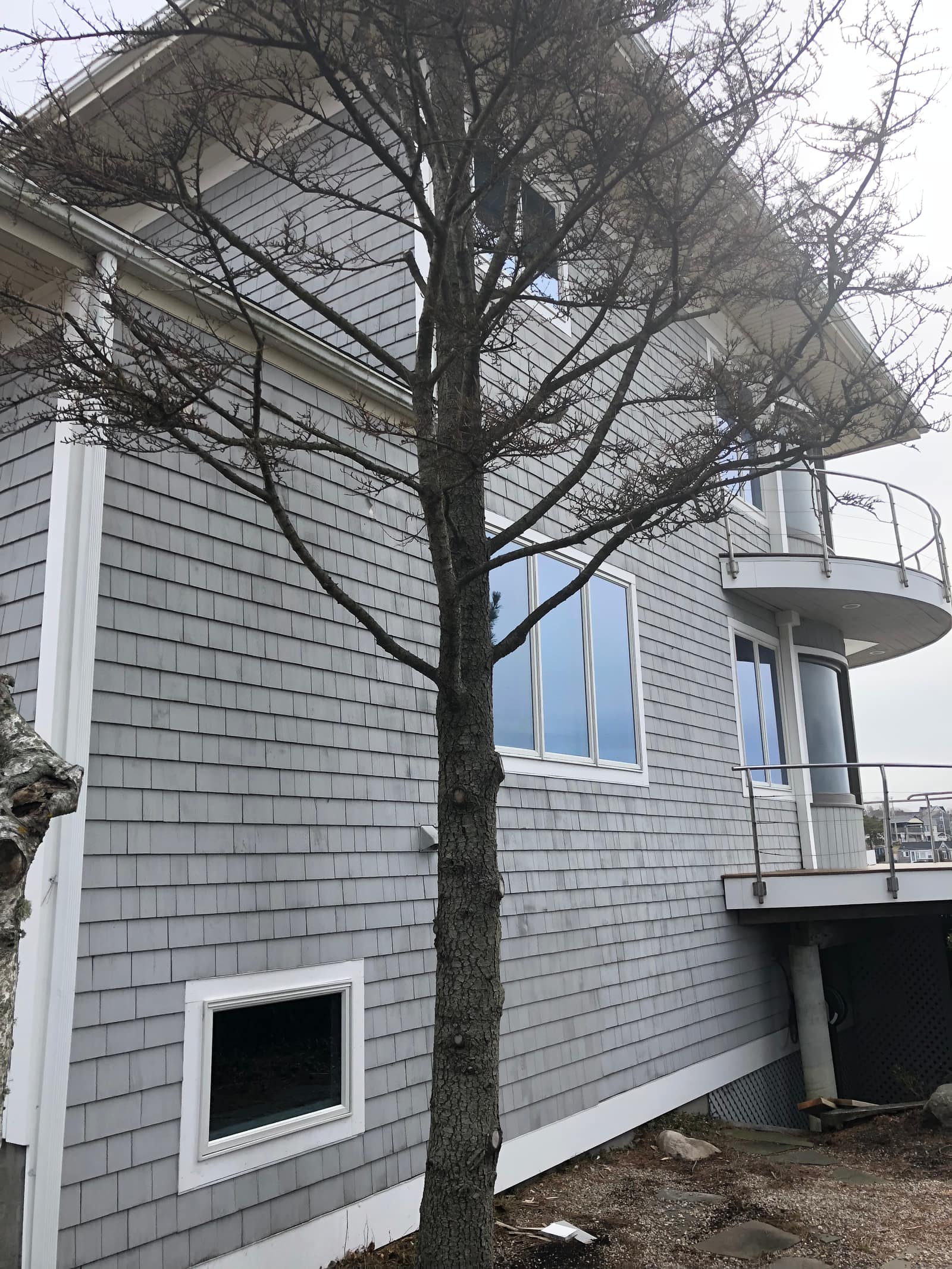 Waterfront shingle-style home exterior in Falmouth
